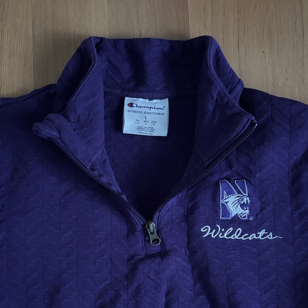 Northwestern University purple quarter-zip athletic wear top
